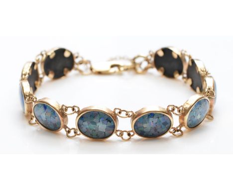 A 9ct gold opal triplet panel link bracelet18cm, 11.4gm 