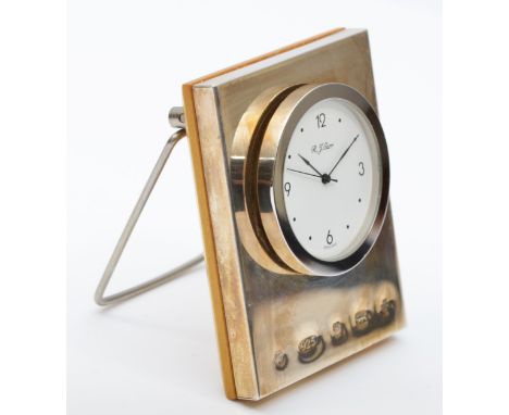 R.J. Carr, a silver cased quartz desk clock, prominent hallmarks, Sheffield 2000, Millennium hallmark, 73 x 57mm.Battery flat