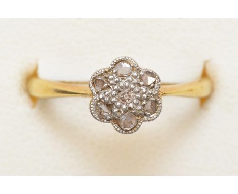 An Edwardian 18ct gold and rose cut diamond daisy cluster ring, K 1/2, 2.2gm 