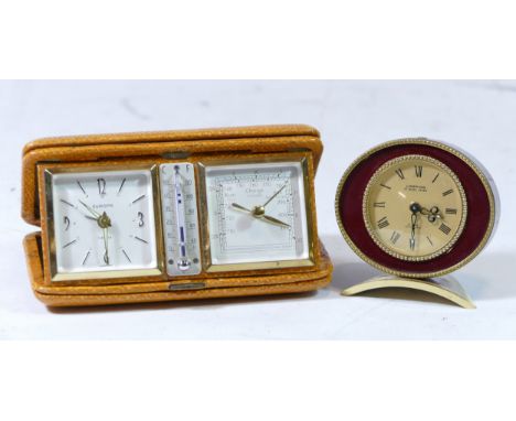A 1960s Europe travel alarm clock with thermometer and barometer, having jewelled 8 day German movement, together with a 1960