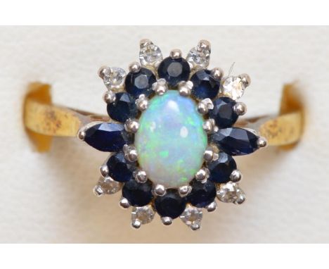 An 18ct gold, opal sapphire and diamond cluster ring, O, 4.9gm