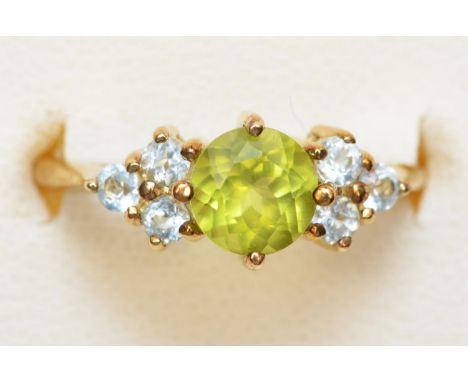 A 9ct gold peridot and topaz dress ring, K, 2.1gm 