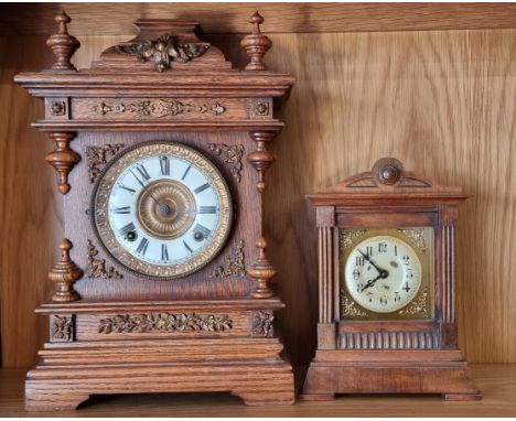 An early 20th century oak cased American Ansonia mantel clock, with 8 day movement striking on gong, 40cm tall,  together wit