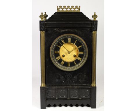 A Victorian Aesthetic period polished slate mantel clock, circa 1875-85, the black porcelain dial centred with embossed brass