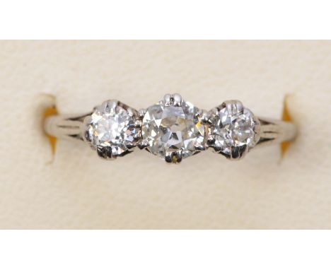 An 18ct white gold and old cut brilliant three stone diamond ring, claw set with graduated stones, weight approximately 0.60c