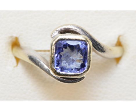 A 9ct white gold single stone collet set tanzanite ring, K, 3.5gm 