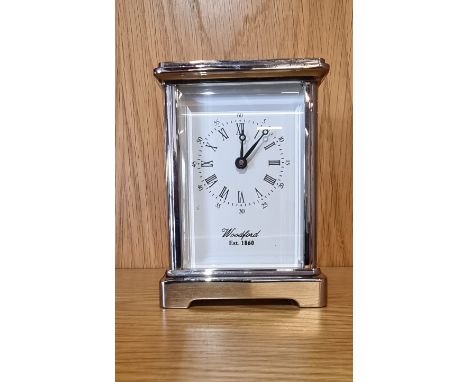 A Woodford chrome plated 8 day carriage clock, having white enamelled dial with Roman and Arabic numerals.12cm tall. 