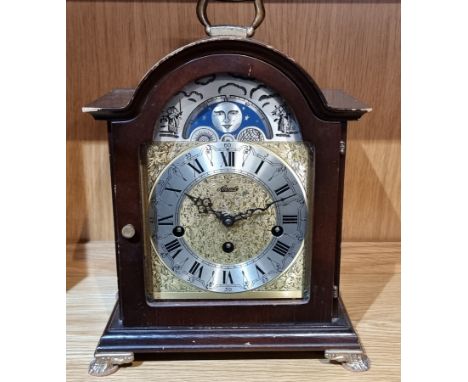 A German mahogany bracket clock by Hermle, with embossed gilt dial and slivered chapter ring with moon phase, the 8 day movem
