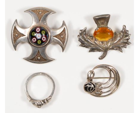 A Caithness Glass Celtic brooch, Edinburgh 1971, a thistle brooch, by Robert Allison, Glasgow, 1961, a Mackintosh style brooc