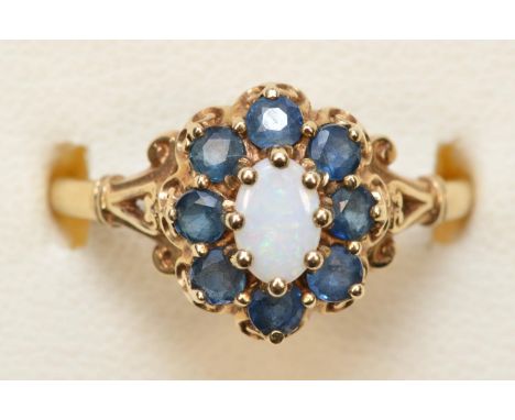 A 9ct gold opal and sapphire cluster ring, R, 2.4gm 