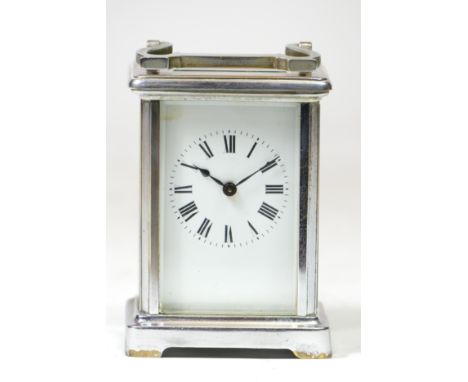 A French 8 day carriage clock, chrome plated case with enamelled dial and Roman numerals, movement stamped Made In France. 12