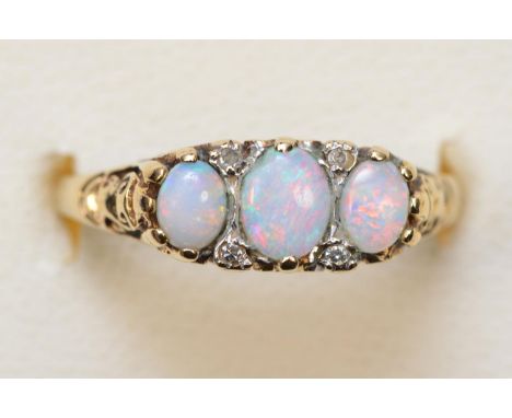 A vintage 9ct gold gold opal three stone ring, diamond points between, M 1/2, 2.4gm 