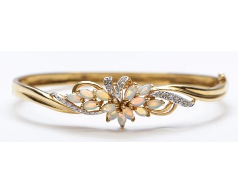 A QVC 9ct gold opal and diamond hinged bangle,internal 58 x 52mm, 10.8gm 