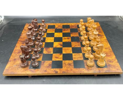 A wooden chess set with complete pieces made by Masenghini Bergamo. 