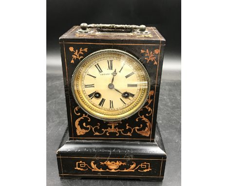 A wooden cased mantle clock with 8 day movement marked Charles A Paris to face, back panel is marked W.R. Crabbe Bristol insi