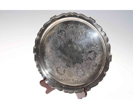 Edwardian silver salver with engraved decoration by William and George Sissons, London 1903, 30cm diameter.