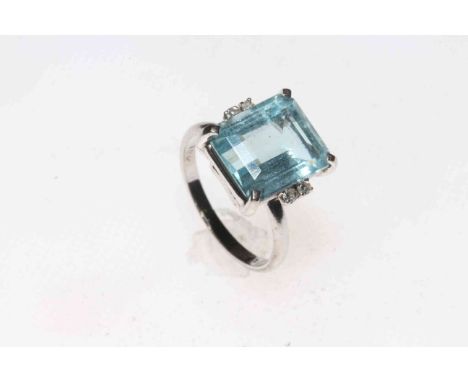 18k white gold, aquamarine and diamond ring, the rectangular cut aqua approx 3.5/4 carat, with two tiny brilliants on each si