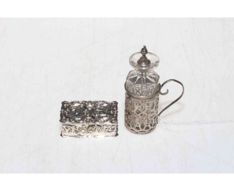 Embossed silver pill box decorated with cherubs and scrolls, and smelling salts bottle in silver holder (2).