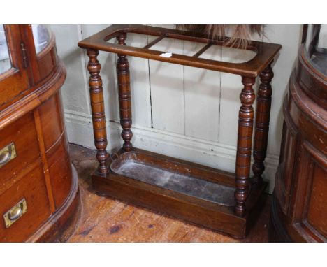 Victorian oak three division stick stand with turned pillars, 61.5cm high by 61cm wide by 24cm deep.