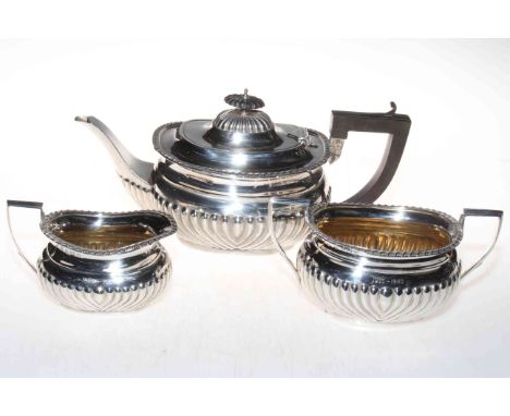 Silver three piece tea set having part fluted bodies, Birmingham 1939, with original retailers box.