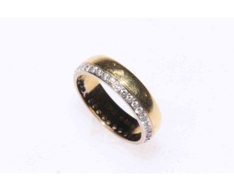 18 carat gold band ring with eternity row of diamonds, size L.