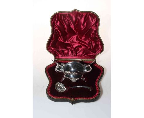 Shaped cased silver sucrier and sifting spoon, the elegant lobed oval body with cast border and feet, London 1902.