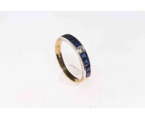 18 carat gold nine stone sapphire and diamond band ring, size K.