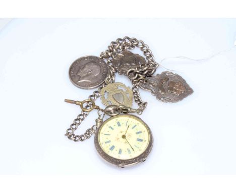 Continental pocket watch with silver albert having attached WWI medal for 287704 G. Young SPO R.N. Royal Navy and two medals.