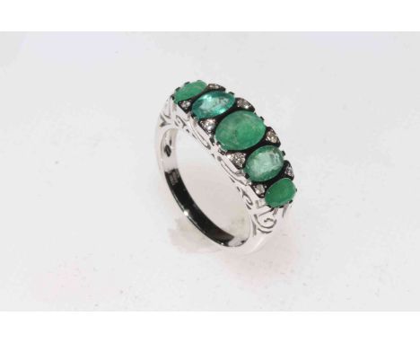 14k white gold and five stone emerald ring with eight small diamonds, size M, with certificate.