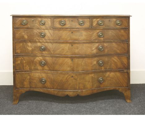 A large serpentine mahogany commode, circa 1780, with oak drawer linings and upon splayed bracket feet, 141cm wide, 61cm deep