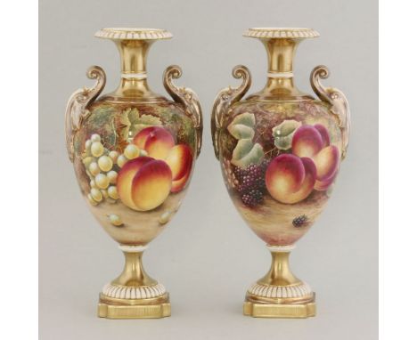 A pair of Royal Worcester urns, decorated with fruit, by R E Price, printed mark and numbered 1969/2 and RS/BS (2)