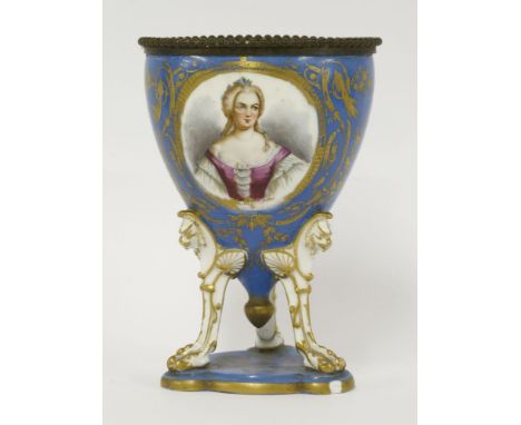 A Sèvres porcelain urn, with a bleu celeste ground centred with an oval portrait of Queen Josephine, raised on monopedia legs