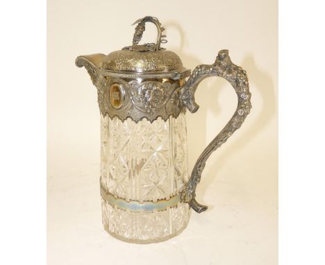 A Victorian silver plated and cut glass jug, the cast mount with grapes, naturalistic handles and mask to the spout, the fini