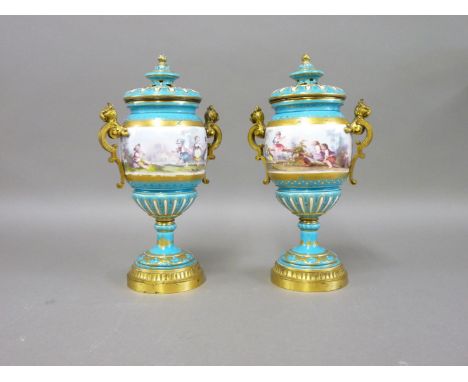 A pair of Minton style vases, with hand painted scenes of children playing, upon a turquoise ground, gilded and raised enamel