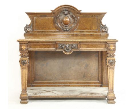 A Victorian burr walnut buffet, in Renaissance style, the low arched carved back with oval cartouche, over a long frieze draw