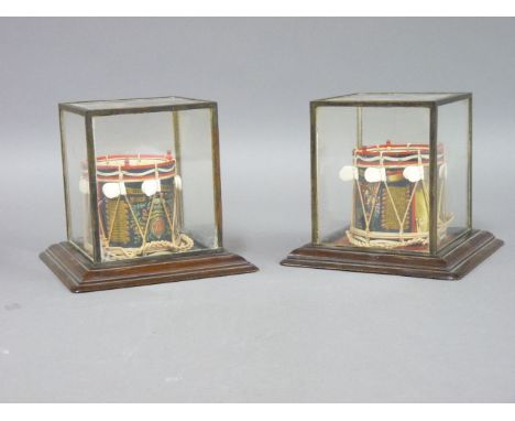 A pair of miniature British Army drums, for the Black Watch Royal Highlanders and The Queen's Royal Regiment, each painted wi
