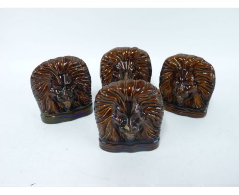 A set of four Victorian treacle glazed lion sash window stops (4)