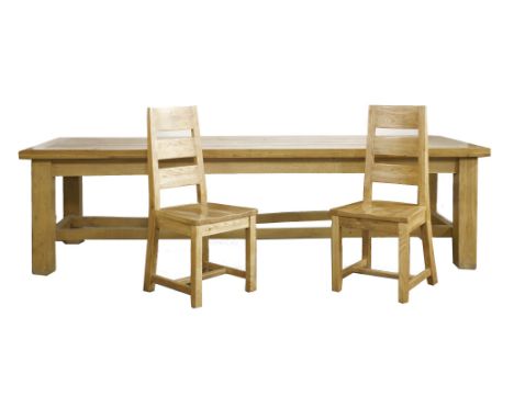 A modern light oak refectory table, with plank top, 290cm long x 107cm wide, and eight ladder back chairs with solid seats (9