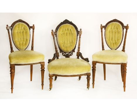 A Victorian walnut low nursing chair, with mustard velvet seat and button back, together with a pair of matching side chairs 