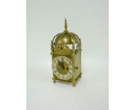 A reproduction brass lantern clock, with a single fusee movement, and a silvered chapter ring, 36cm high