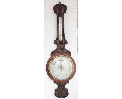 A Victorian carved walnut wheel barometer, with silvered dial and inset thermometer, 100cm