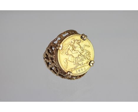 A Victorian gold half sovereign set ring dated 1894, within a four claw setting and pierced 9ct yellow gold ring mount, total