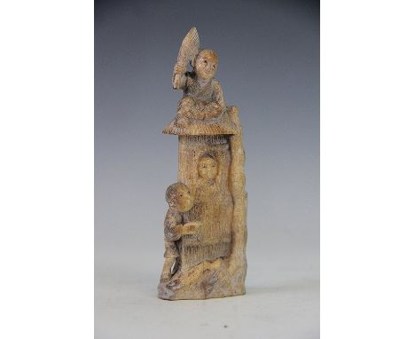 A Chinese carved soapstone figure of young boys playing behind a screen, 16cm high 