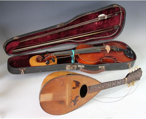 An early 20th century violin, with 35.5cm two piece back (without button), in case with two bows, with a mandolin (2)