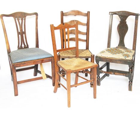 A George III oak chair, with rustic repairs, a George III oak dining chair, with drop in seat, with two oak ladder back chair