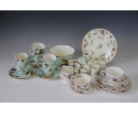 A Royal Worcester part tea service, decorated in relief with gilt storks, bamboo and foliage against a celadon ground, with s