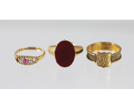 Three rings, to include; a Victorian 18ct gold mourning ring inset with hair, an 18ct ruby and diamond set ring (at fault), a