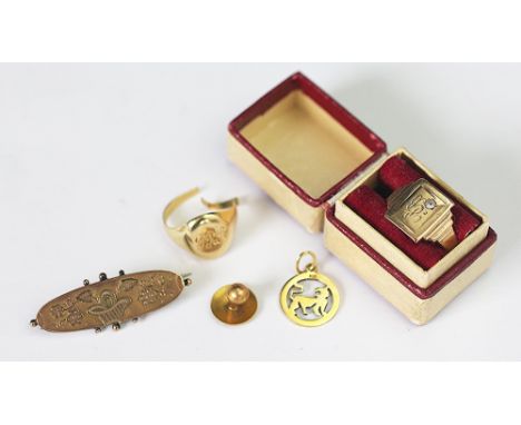 A 9ct yellow gold signet ring, initialled, a yellow metal signet ring (unmarked) engraved initials, a shirt stud stamped 'BH 