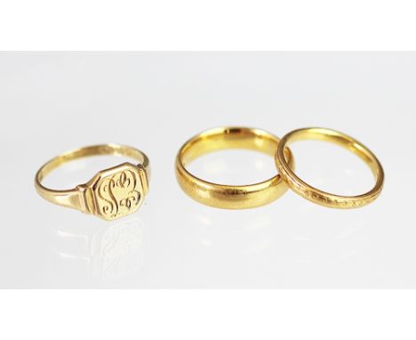 Two 22ct yellow gold wedding bands, weight 9.6gms and an 18ct yellow gold signet ring, weight 3.6gms (3) 