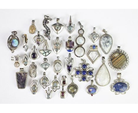 A quantity of assorted stone set pendants, to include; ametrine, ruby, moonstone, labradorite, snowflake obsidian, topaz, rut